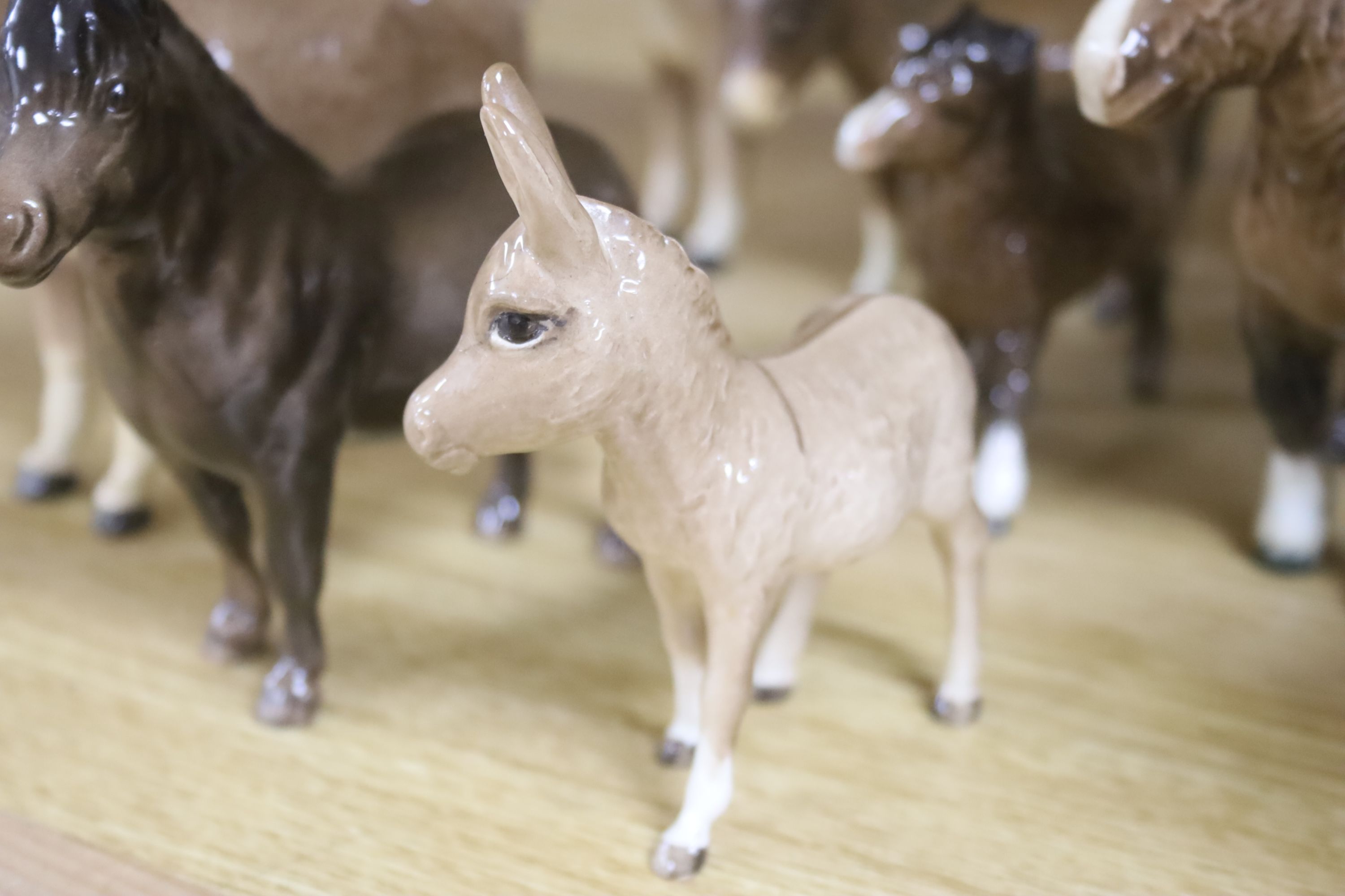 Four Beswick Shetland ponies and four Beswick donkeys